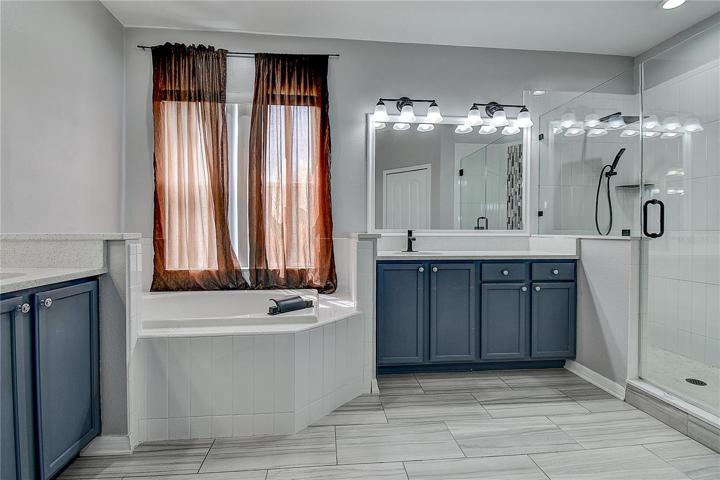 Master bath with separate vanities and updated shower.