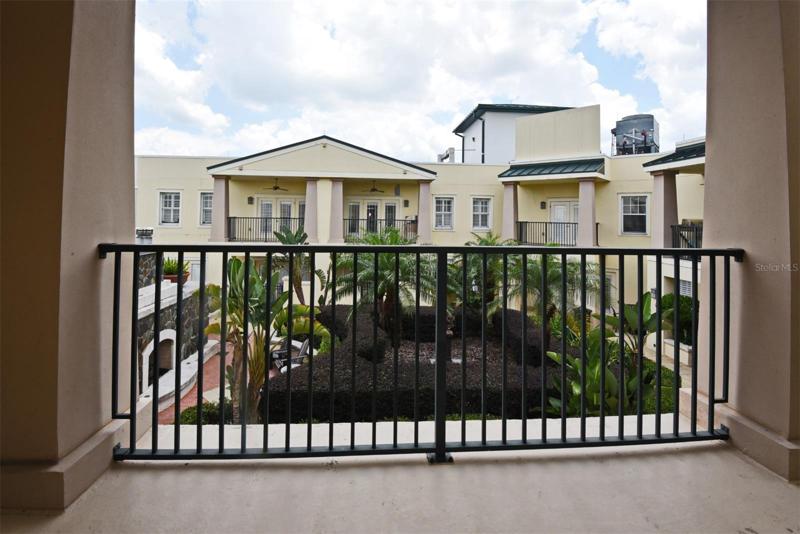 Balcony View of Landscaped Gardens + Gas Fireplaces
