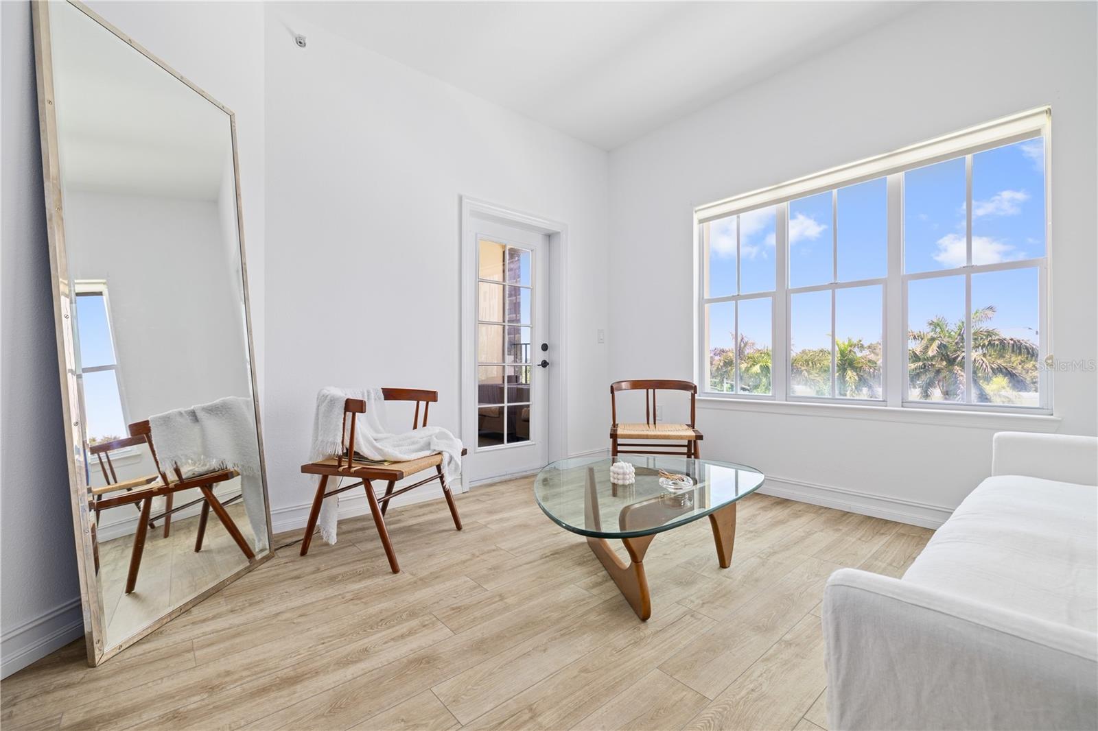 White Oak LVP and fresh paint throughout keep this unit bright and airy