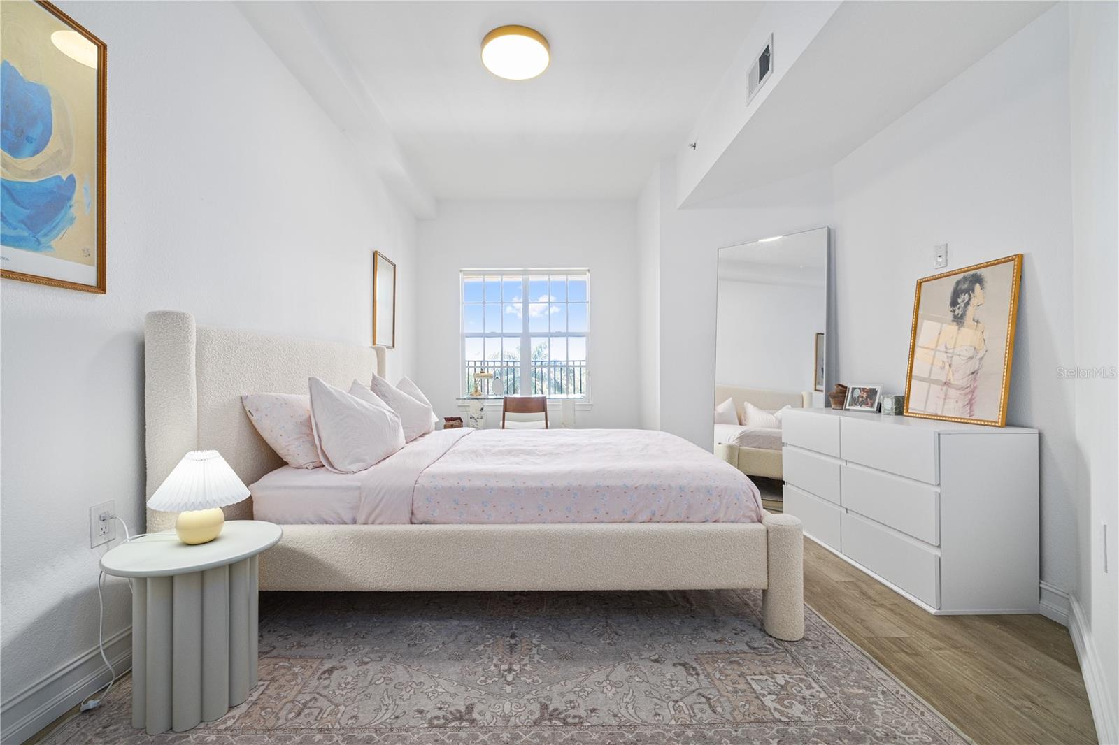 23' primary bedroom boasts a lifted ceiling that makes so much sense