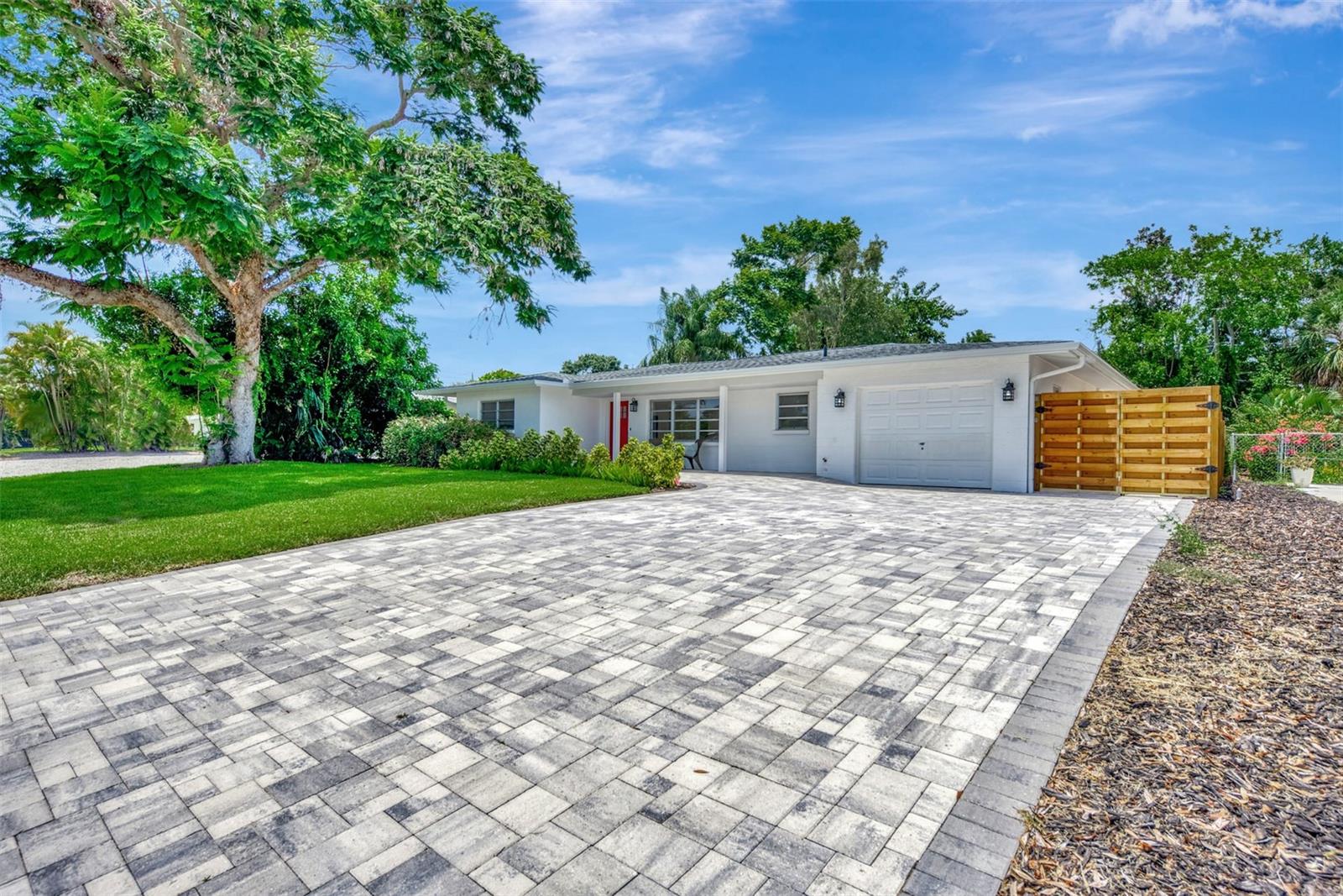 Gorgeous pavers, and the driveway is extra wide and long to accommodate your friends and family