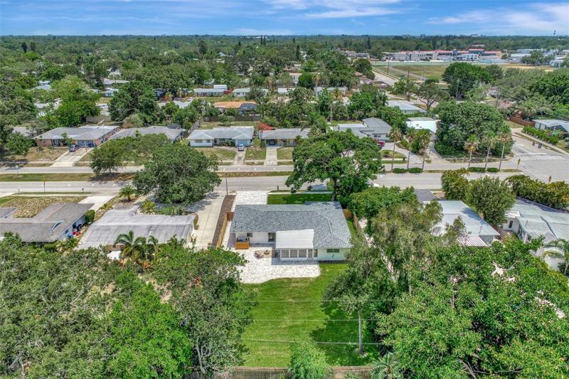 Aerial of the house with a focus on the backyard