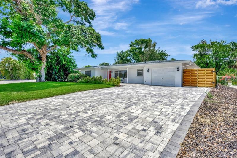 Gorgeous pavers, and the driveway is extra wide and long to accommodate your friends and family