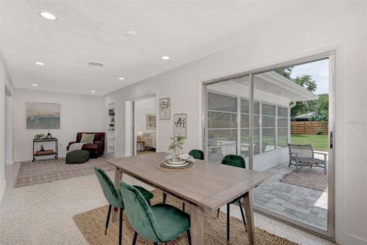 Dining with slider to outdoor pavered patio