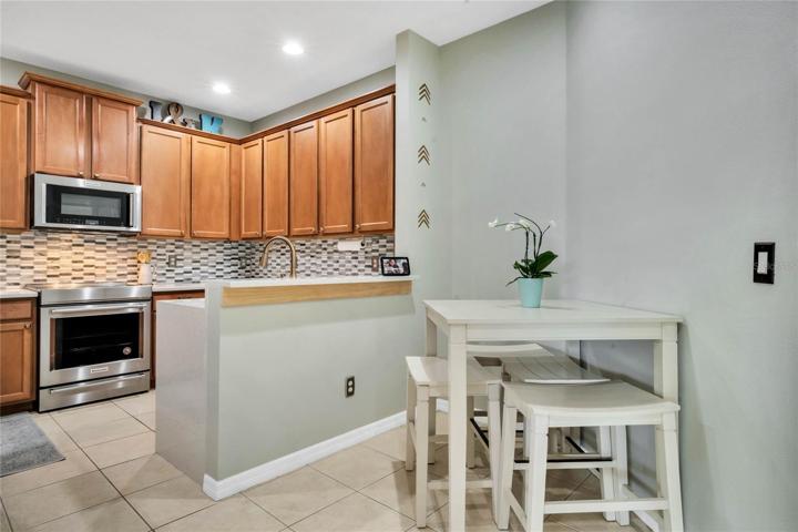 Kitchen has high end appliances, slide in range
