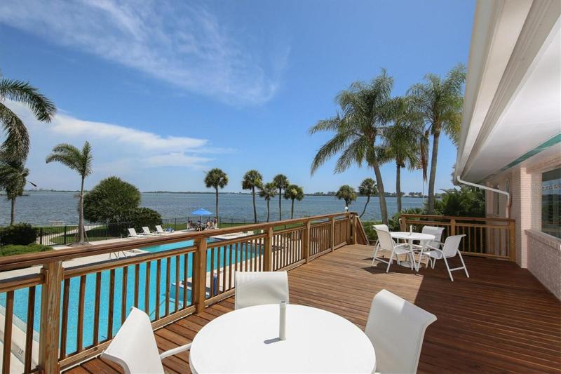 Socialize with friends on the deck of main clubhouse overlooking Intracoastal & pool
