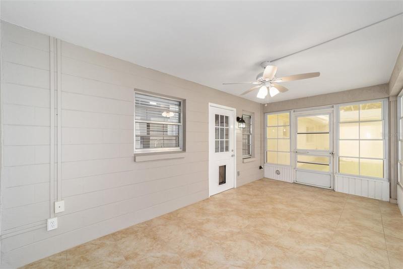 Enclosed porch in rear of home