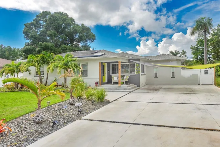 Exterior front with custom concrete driveway