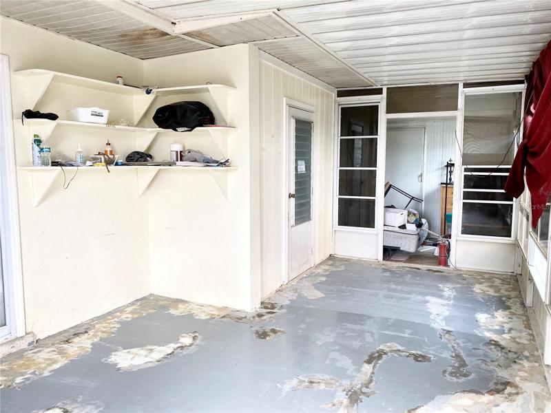 5775 Screened in patio, with a view of the exterior storage room.