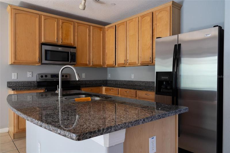Large kitchen with gorgeous granite countertops, 42