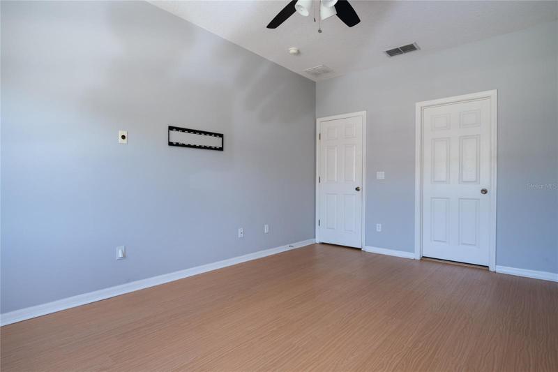 Owner's Suite towards entrance (left) and private bath (right).