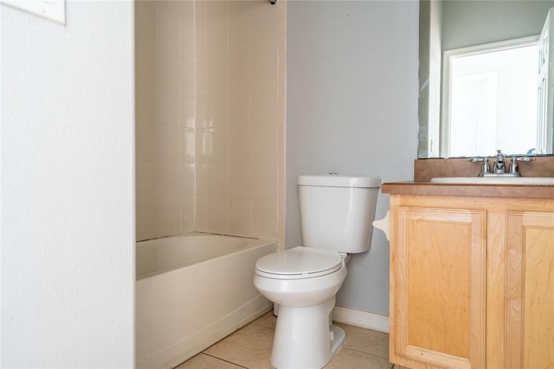 Guest bath with tub/shower combo.