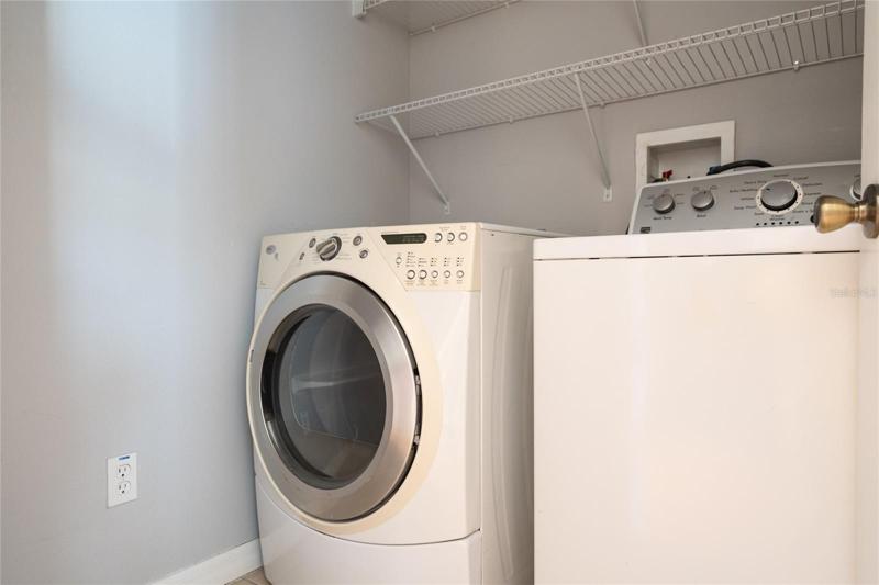 Washer and dryer in utility room stay with your new home.