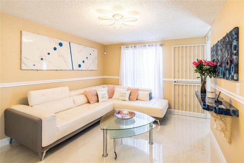 Very glossy porcelain tilethroughout