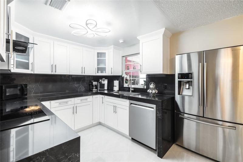 Kitchen, new cabinets, quarts countertop, cooktop, Range hood.