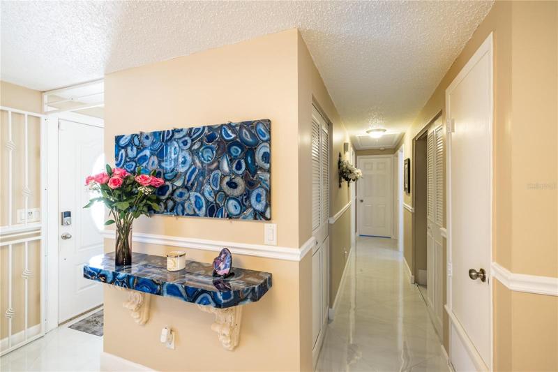Hallway bath, quartz shower stall, modern fixtures