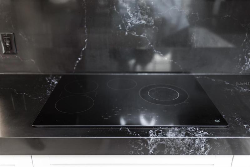 Kitchen cooktop matches countertop.