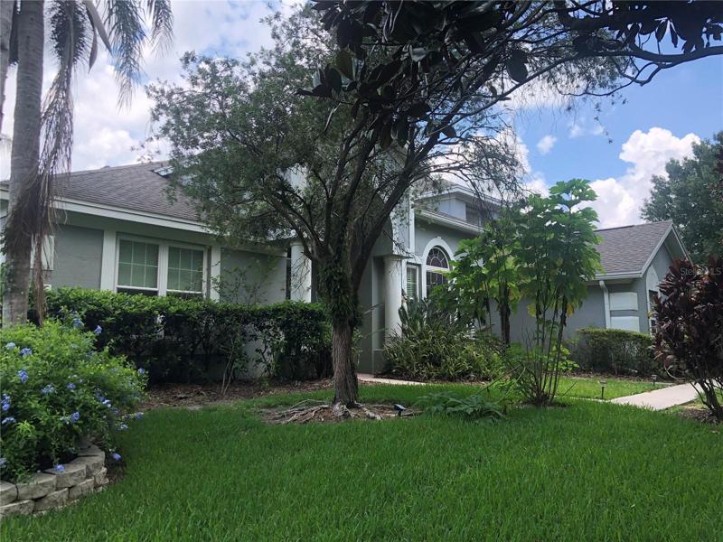 Drive the tree lined street of Seville Chase to your new home.