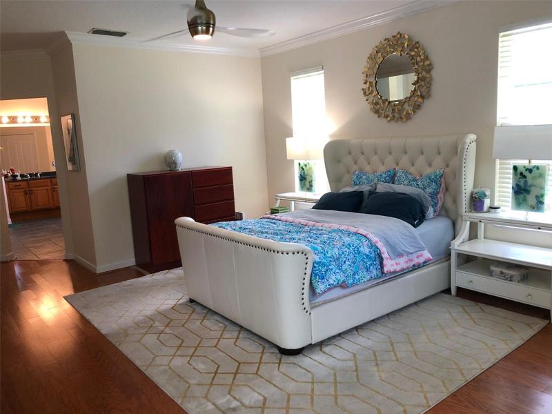 First Floor Master Bedroom is spacious and has beautiful wood floors