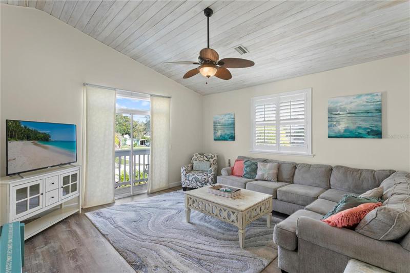 Imagine relaxing with the family in this coastal themed living room.