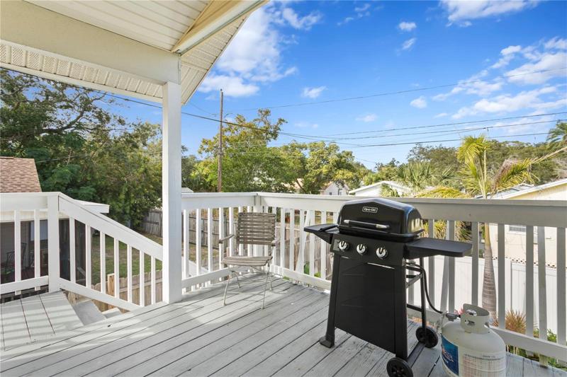 This deck is off the kitchen.