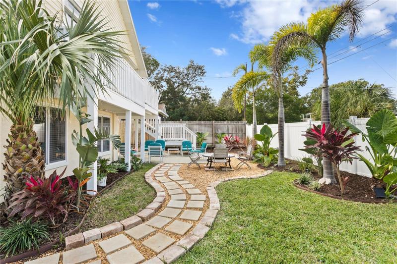 The yard has been landscaped and set up for entertaining family and friends.