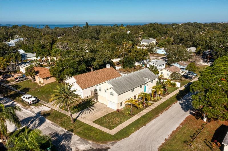 Large corner lot, parking for a smaller boat or RV, room for cars as well.