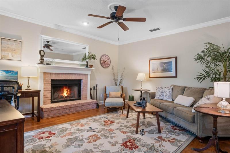 Den with wood fireplace