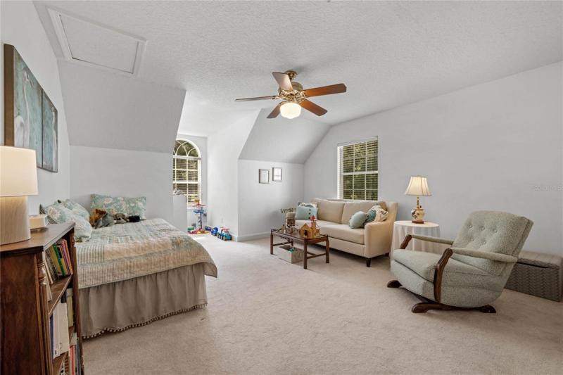 Bedroom 4 with double built-in closets and dormer windo