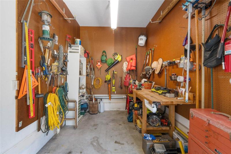 Garage workshop and room to park a golf cart