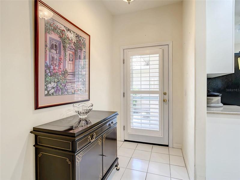Foyer and note the Custom Plantation shutters on the front door