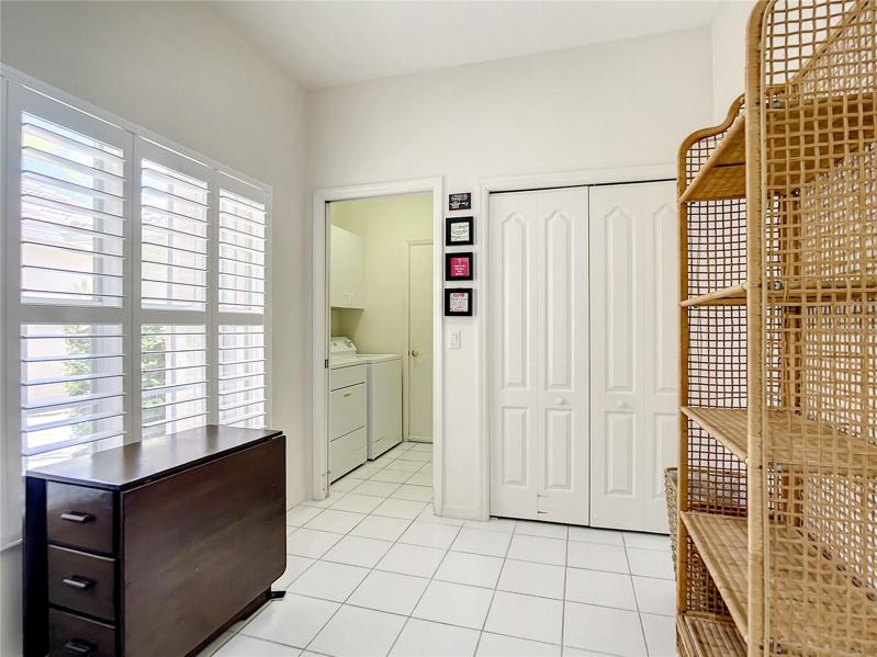 Dinette Area in the Kitchen. Custom Plantation Shutters on the Large Window providing a bright and open space. Large Pantry for convenience and inside Laundry with Washer and Dryer included. Door exits into the 2 car garage.