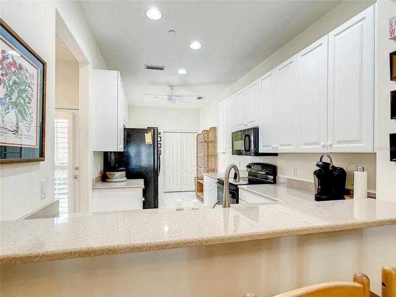 View of the breakfast bar and kitchen from the Dining area