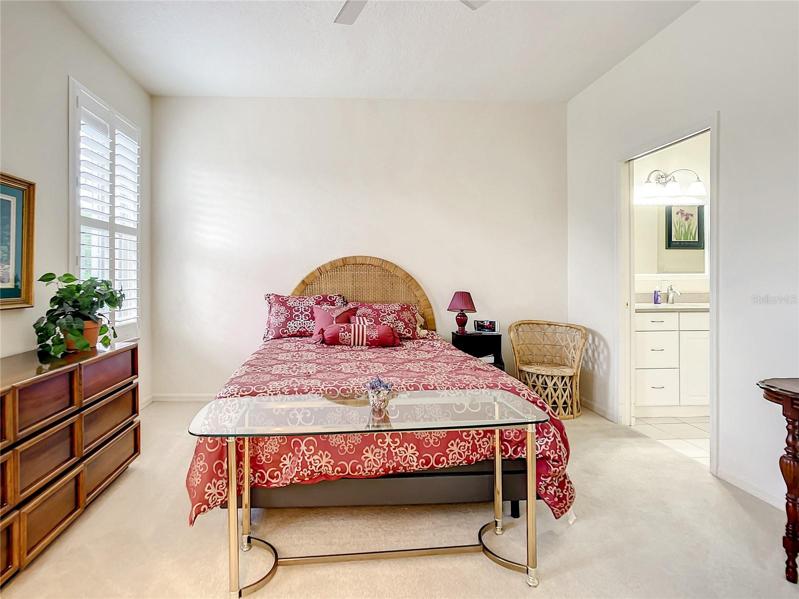 Large and Spacious Master Bedroom and Large Window for Plenty of Light and Custom Plantation Shutters. Bath is conveniently located to the right