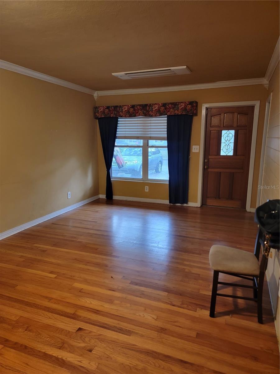 Living Room with beautiful wood floors and crown molding
