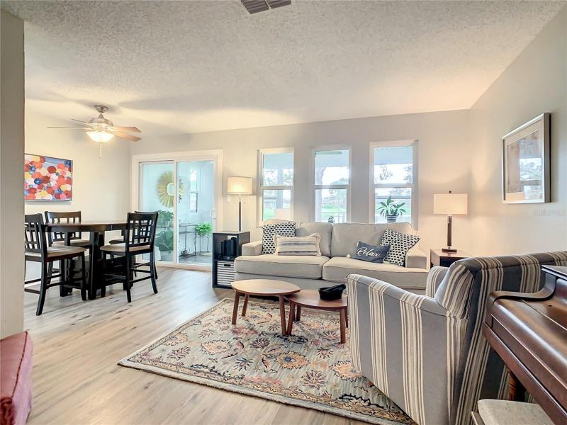 Living room has sliders opening to the Sun Room