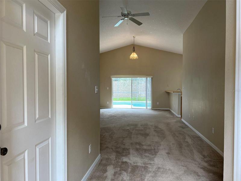 Open floor plan - family room to the kitchen, pool, and bedrooms on both sides.