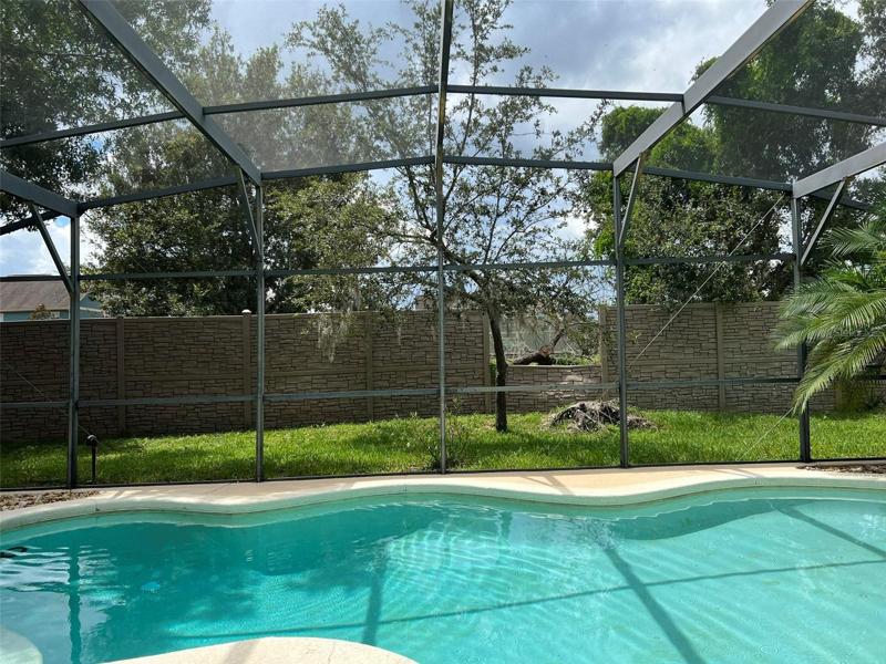 Private screened-in pool area.