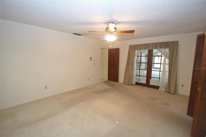 Master bedroom with french doors leading to the lanai
