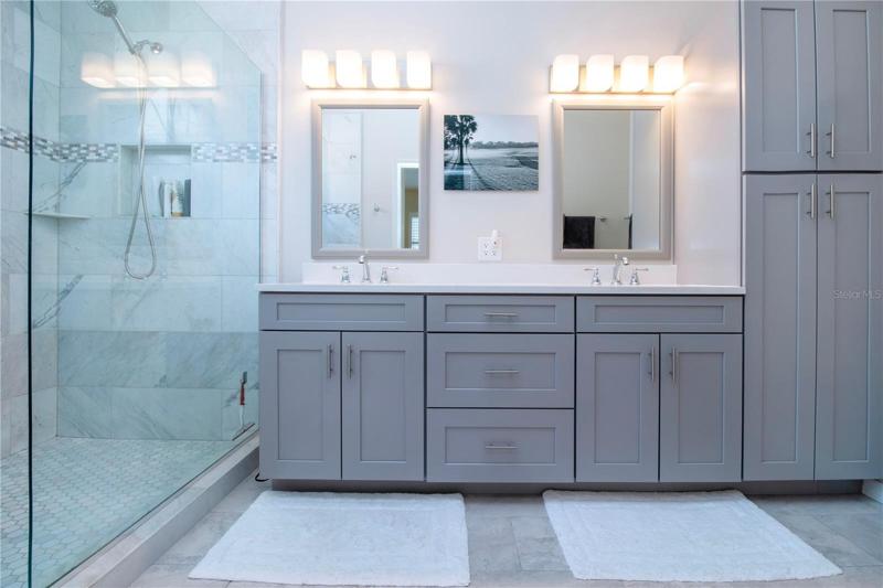 upgraded cabinets, quartz countertop, double sink and walk in shower