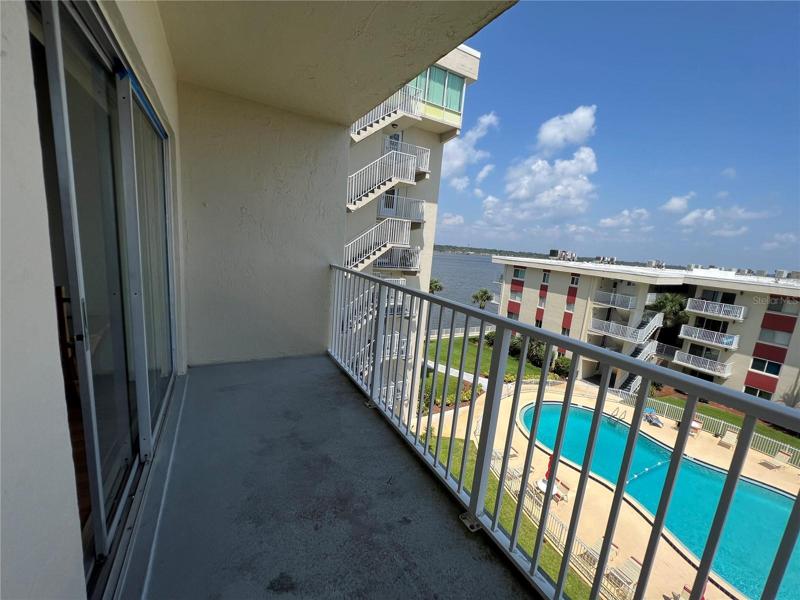 LOOK OUT FROM YOUR BALCONY TO THE BEAUTIFUL POOL/RECREATION AREA