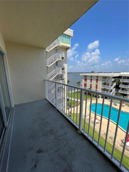 LOOK OUT FROM YOUR BALCONY TO THE BEAUTIFUL POOL/RECREATION AREA