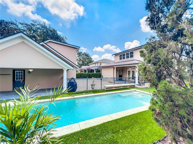 View of the pool from the rear yard patio