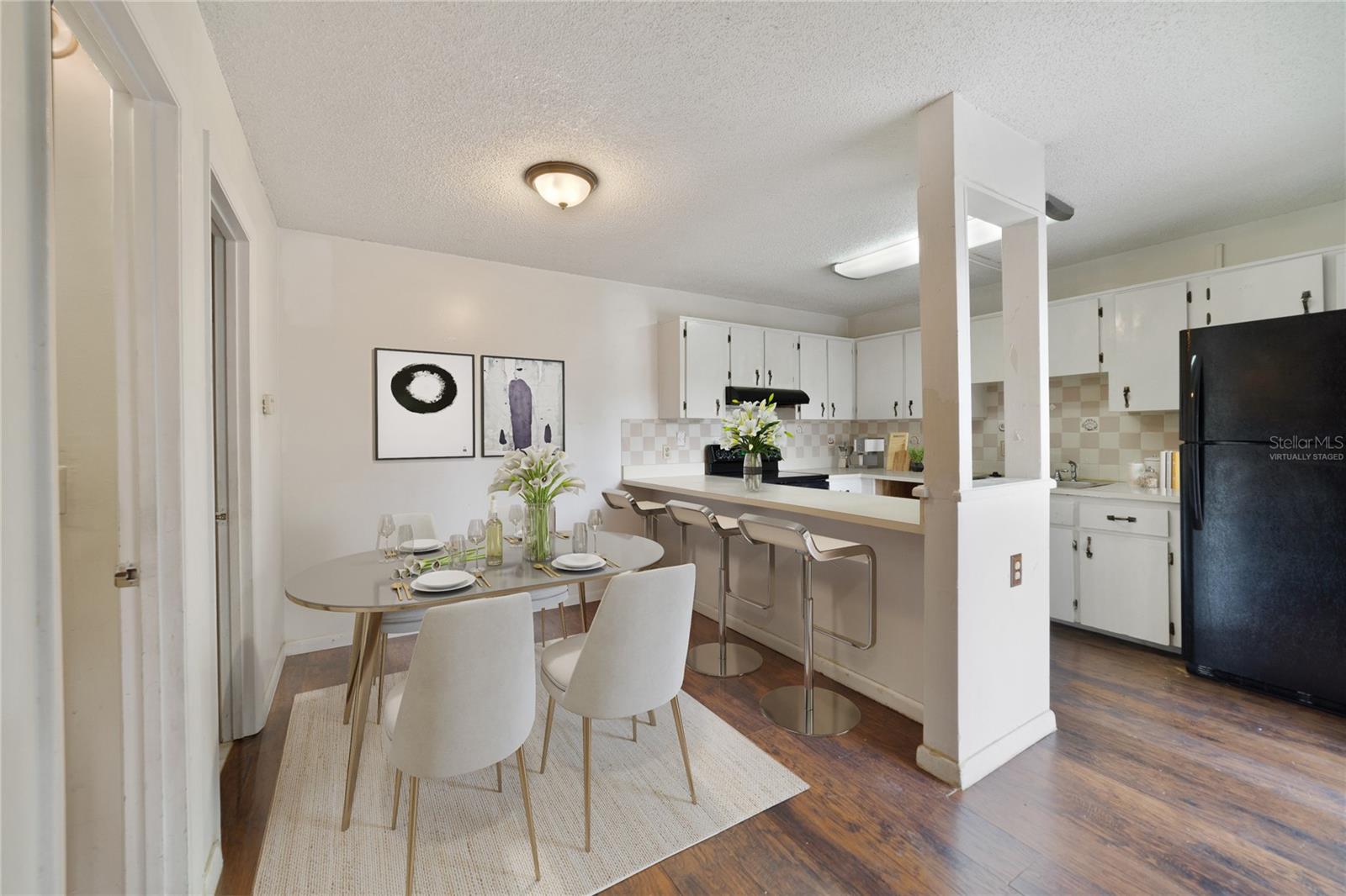 The main floor delivers a comfortable kitchen with breakfast bar seating, dining space and living room - both with sliding glass door access to the patio letting the natural light pour in! Virtually Staged.