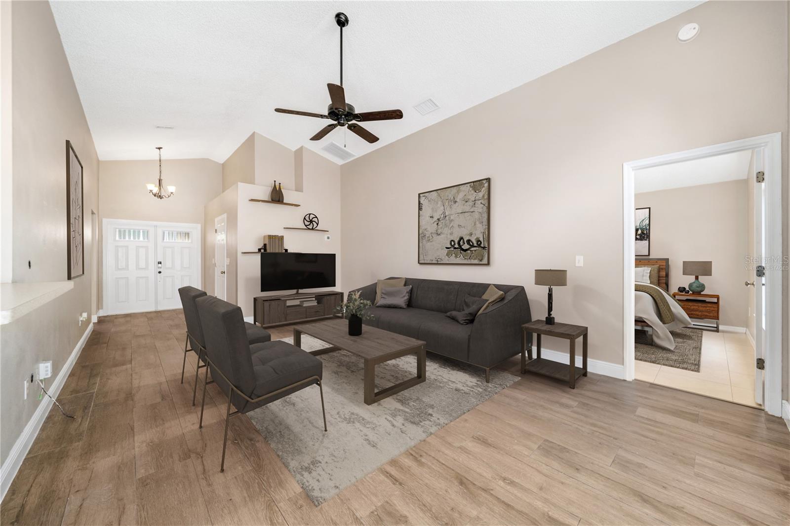 Virtually staged - vaulted ceilings elevate the space