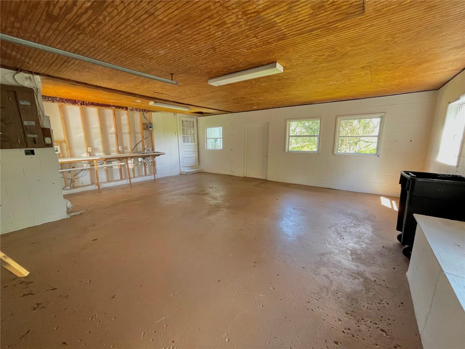 The extended garage has been cleaned out and painted.