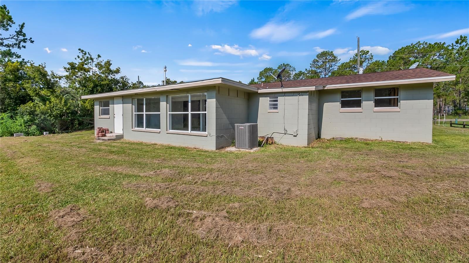 Rear view of 10138 State Road 33, Groveland, FL