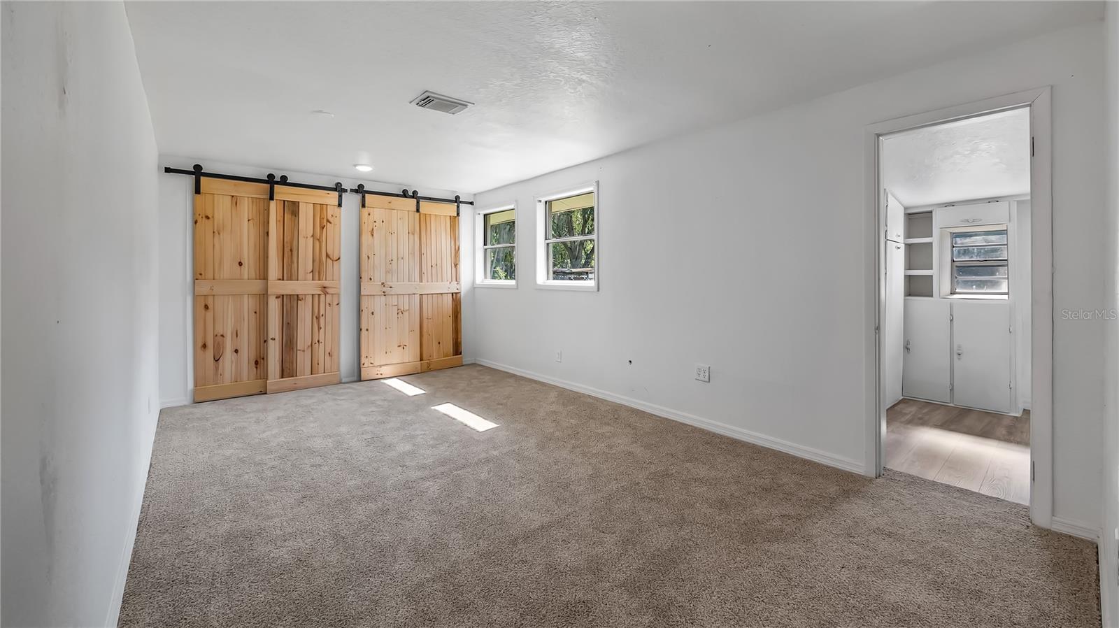 Larger of the private bedrooms, could be master. Connects to master bathroom