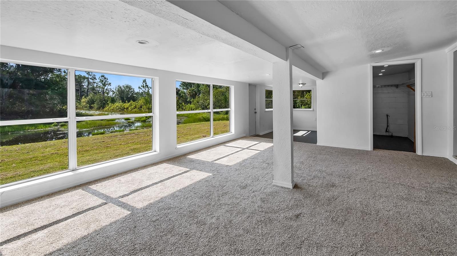 Room off the back of house considered a bedroom with a large walk in closet. Amazing views of the canal.