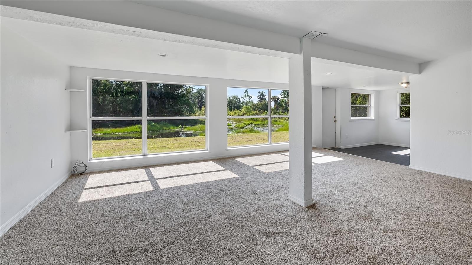 Room off the back of house considered a bedroom with a large walk in closet. Amazing views of the canal.